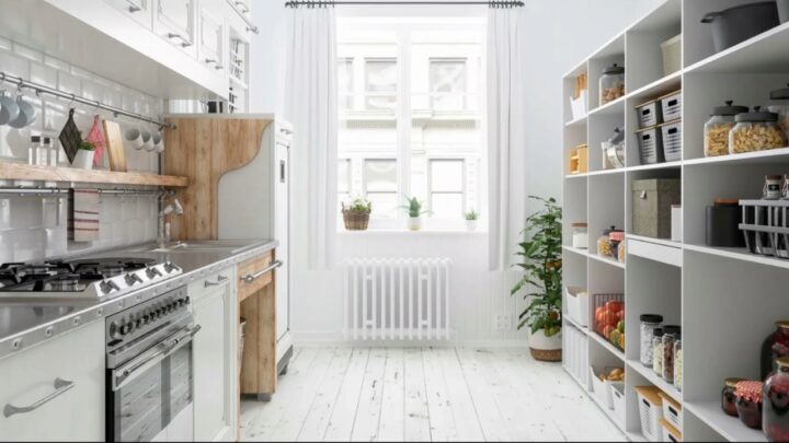 Bright butler pantry with open shelves, jars, baskets, and a compact cook area
