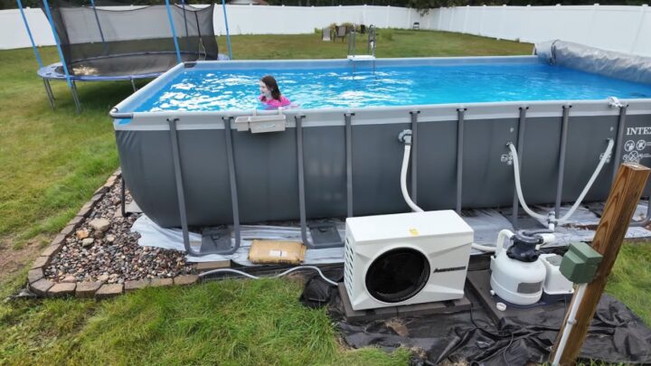 Above-ground pool with a heater and filter system installed beside it