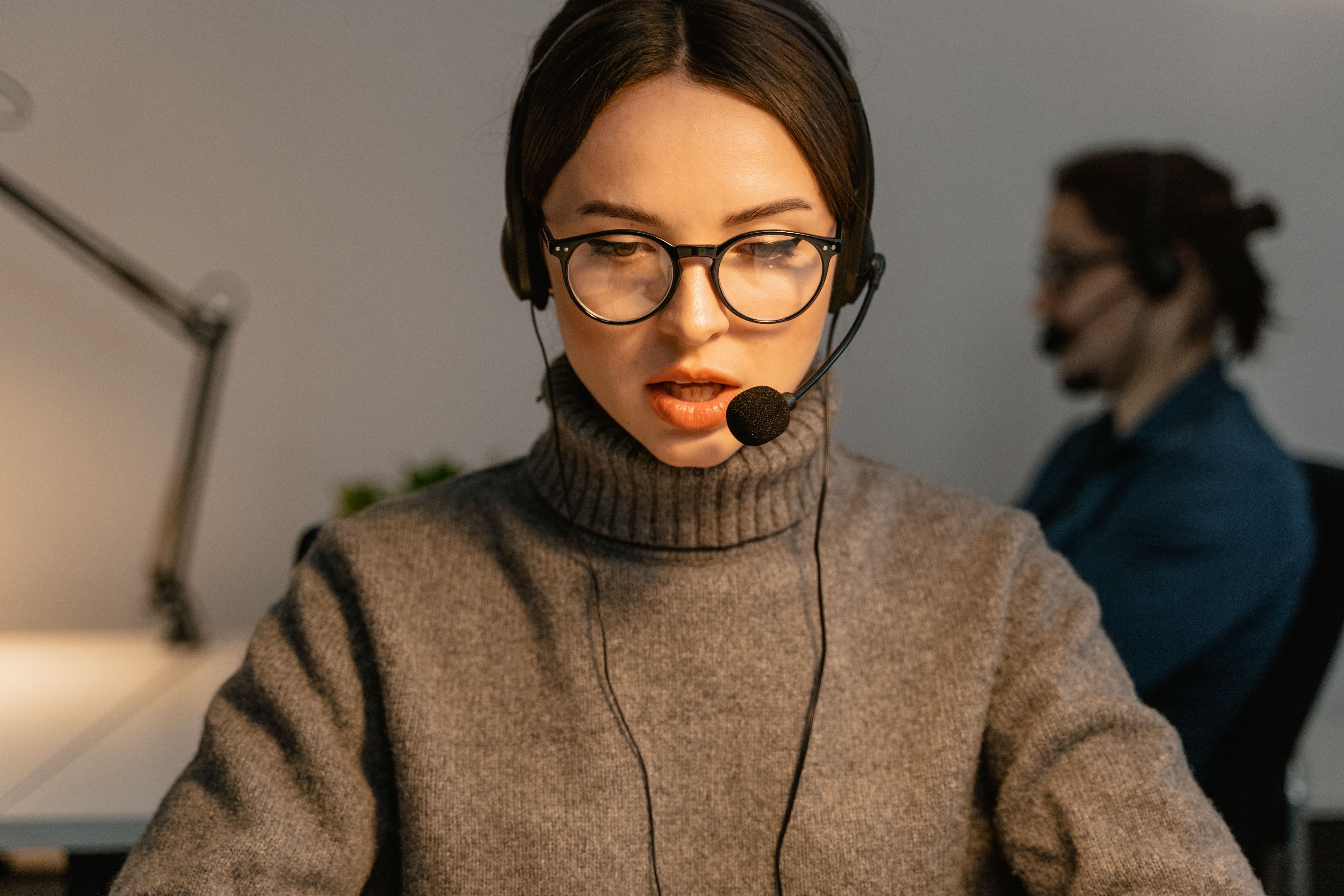 Call center agent wearing a headset, representing traditional customer contact being replaced by messaging apps